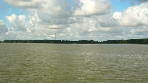 Fast movement over lake, far shore and cloudy blue sky. hyperlapse shot. Stock Footage 170606484