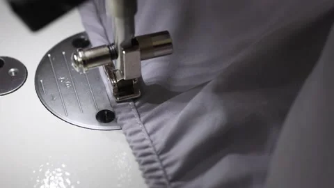 Fast movement of the sewing machine needle on the fabric. Stock Footage 165797478