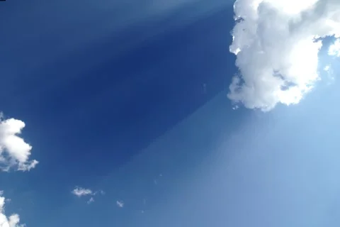 Fast movement of white clouds against blue sky Stock Footage 313838400
