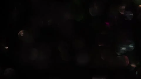 Fast moving bokeh lights shining in the dark Stock-Footage 318367415