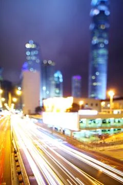 Fast moving car light on highway Stock Photos