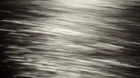 Fast moving closeup texture of unusual sparkles on dark background. Vidéo 47221615