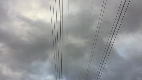 Fast moving clouds above power lines before a hurricane Stock Footage 95005672