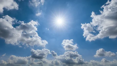 Fast moving clouds and blue sky with sun. Video stock 181954160