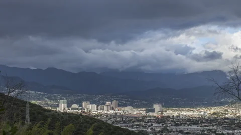 Fast moving clouds and rain over Burbank, Universal City, Los Angeles, Timelapse Stock Footage 130984070