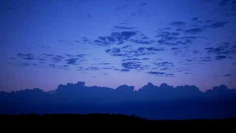 Fast moving clouds and storm at sunrise time lapse  Vídeo Stock 102116745