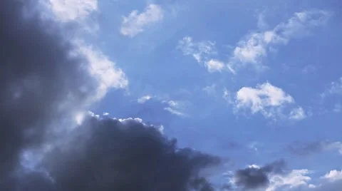 Fast moving clouds in blue sky turning dramatic dark Stock Footage 49990490