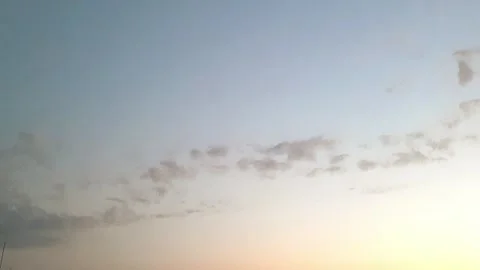 Fast-moving clouds in a blue sky Stock Footage 243733391