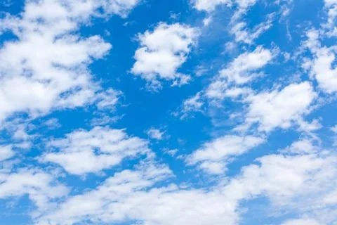 Fast moving clouds in the blue sky Stock Photos