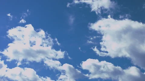 Fast moving clouds on a bright, sunny day 4k Stock Footage 49212497