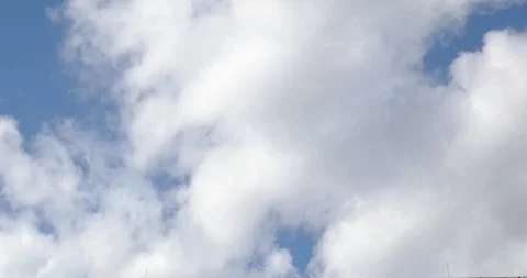 Fast moving clouds captured on sky during sunny day time. Stock Footage 96129771