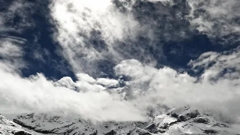 Fast moving clouds covering the mountain peak Stock Footage 330551015