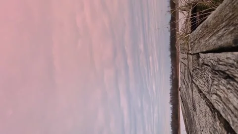 Fast moving clouds in the evening winter sky. Old bridge. Vertical video. Video stock 259430116