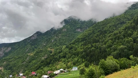 Fast moving clouds on mountain landscape scenic summer forest village Video stock 338046051