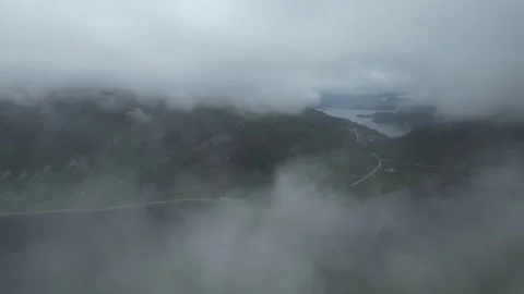 Fast moving clouds in mountains of norway Stock Footage 294203103