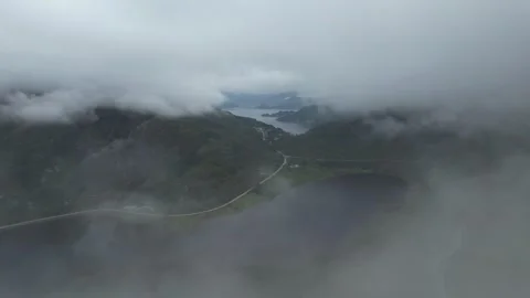 Fast moving clouds in mountains of norway Stock Footage 294203118