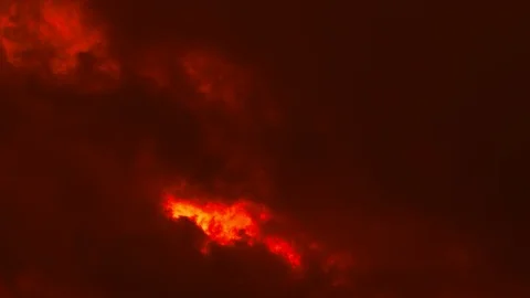 Fast moving clouds or smoke in vibrant fiery colors Vídeo Stock 92756536