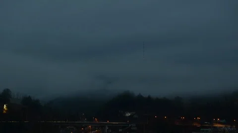 Fast moving clouds over broadcasting tower on the top of the hill. Stock Footage 104432919