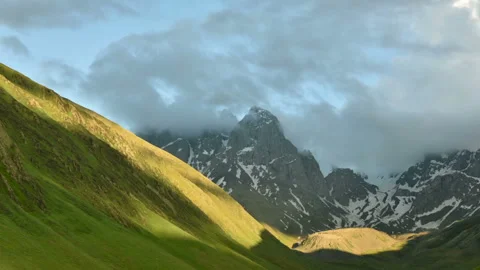 Fast-moving clouds over the Chaukhi mountain range Stock Footage 91358745