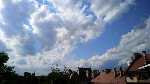 Fast moving clouds over cityscape Stock Footage 168523130