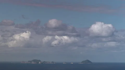 Fast moving clouds over Island in New Zealand HD Stock Footage