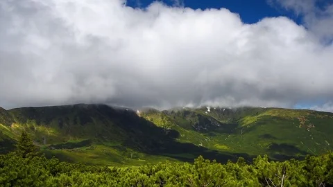 Fast moving clouds over a mountain range Stock Footage 73183307