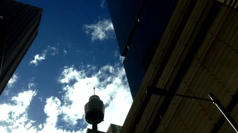 Fast moving clouds race over city buildings. Time Lapse Stock Footage 40752383