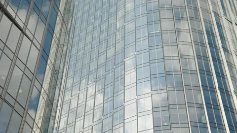 Fast moving clouds reflected on office building glass Stock Footage 187666048