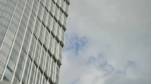 Fast moving clouds reflected on office building glass Stock Footage 187679591