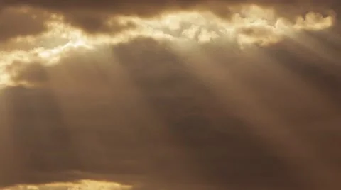 Fast moving clouds with sunbeams shining through them Stock Footage 49990740