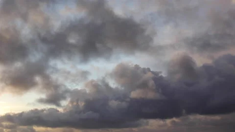 Fast-moving clouds in sunset Stock Footage 143340921
