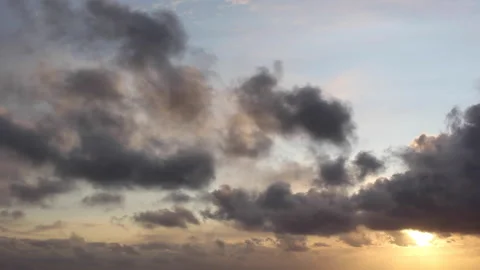 Fast-moving clouds in sunset Stock Footage 143341074