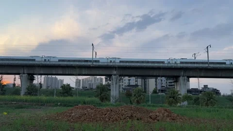 Fast Moving CRH Train on Elevated Railway Bridge in Chengdu During Golden Ho 動画素材 334696658