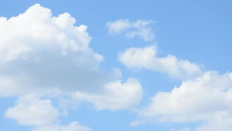 Fast Moving Cumulus clouds Over Blue Sky. Beautiful White Fluffy Clouds Stock Footage 275810023