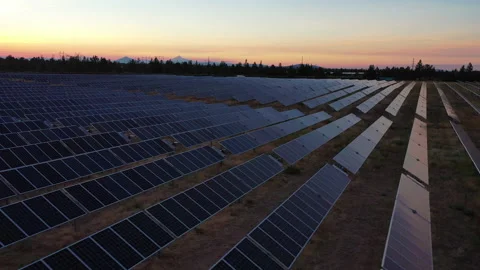 Fast moving drone shot over solar panels at dusk Stock Footage 160889231