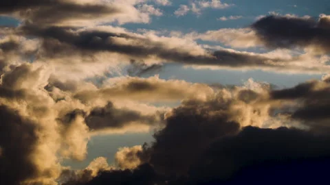 Fast Moving Dynamic Storm Clouds with Golden Light Time-Lapse Stock Footage 318295999