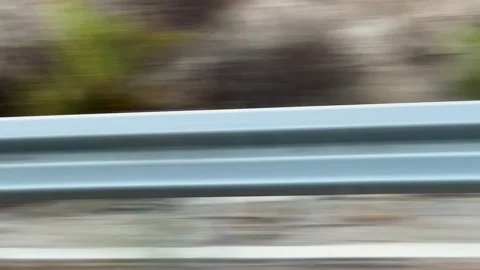 Fast moving guardrail view from a car window showing high speed driving Video stock 343353470