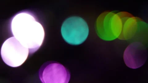 Fast moving light leak from focus colored bokeh Stock Footage 309640909