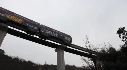 Fast moving light rail train, the carriages are painted with advertisements Stock Footage 47548419