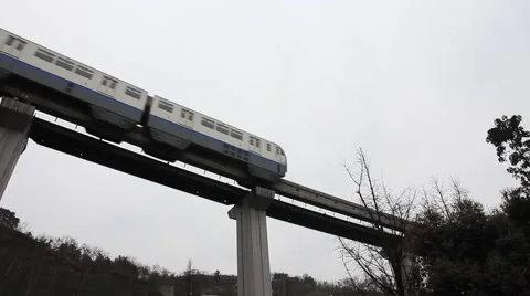 Fast moving light rail train on the overhead viaduct Stock Footage 47548609