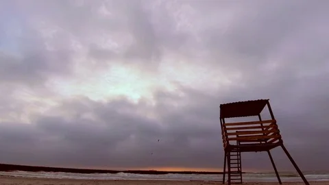Fast Moving Low Clouds Timelapse with Rescue Beach Tower Stock Footage 84186551