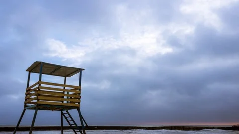 Fast Moving Low Clouds Timelapse with Rescue Beach Tower Stock Footage 84188219