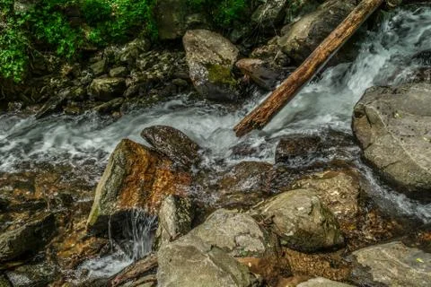 Fast moving mountain stream Stock Photos