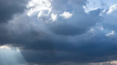 Fast moving overcast clouds. Sun rays breaking through timelapse. Stock Footage 346587296