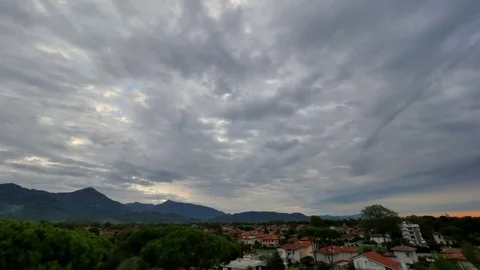 Fast Moving Rainy Gray Clouds TIMELAPSE. Dramatic gray sky over the countryside Stock Footage 76768363