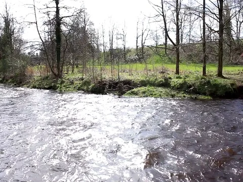 Fast moving river bend Stock Footage 74127823