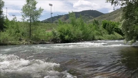 Fast Moving River with Hilltop Background, 1080p Video stock 91868961