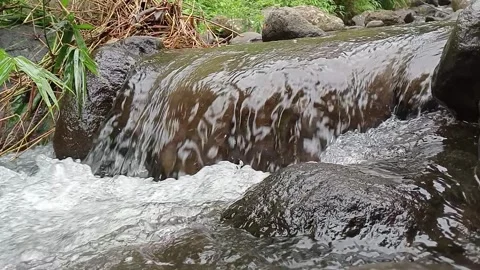 Fast Moving River Stream Over Rocks Cinematic Shot Stock Footage 330329523