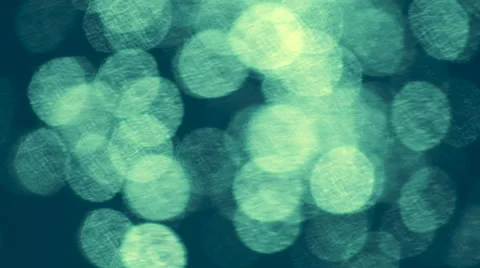 Fast moving shining sparkles on teal wavy water background. 库存影片 47221546
