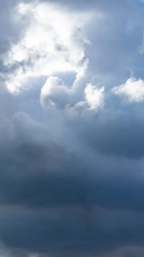 Fast moving sky timelapse. Sun rays breaking thick cloud cover. Stock Footage 346585815